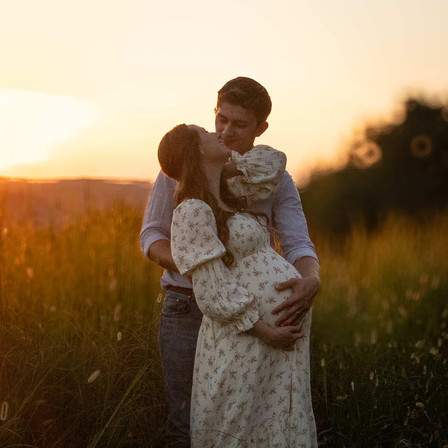 Caitlin and Nolan in the Tennessee meadow at golden hour